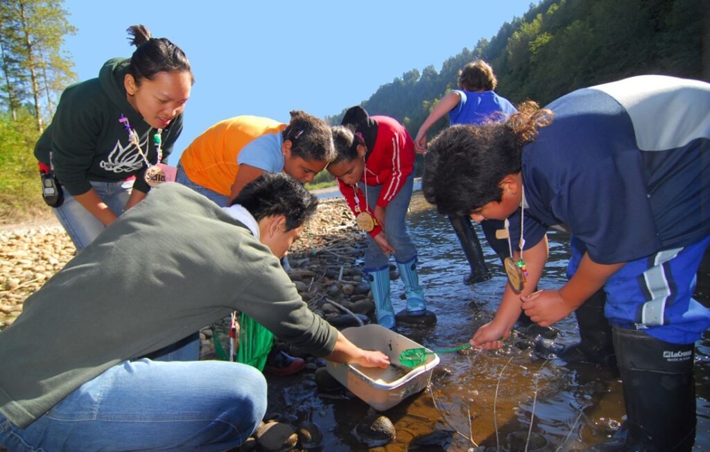 Students testing water at local creek