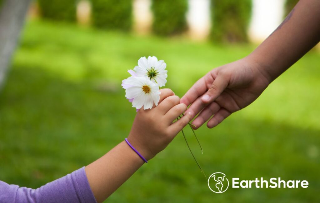 arm held out to accept white flowers