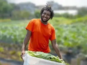 EarthShare-Homepage-Person-with-Vegetables-in-Garden